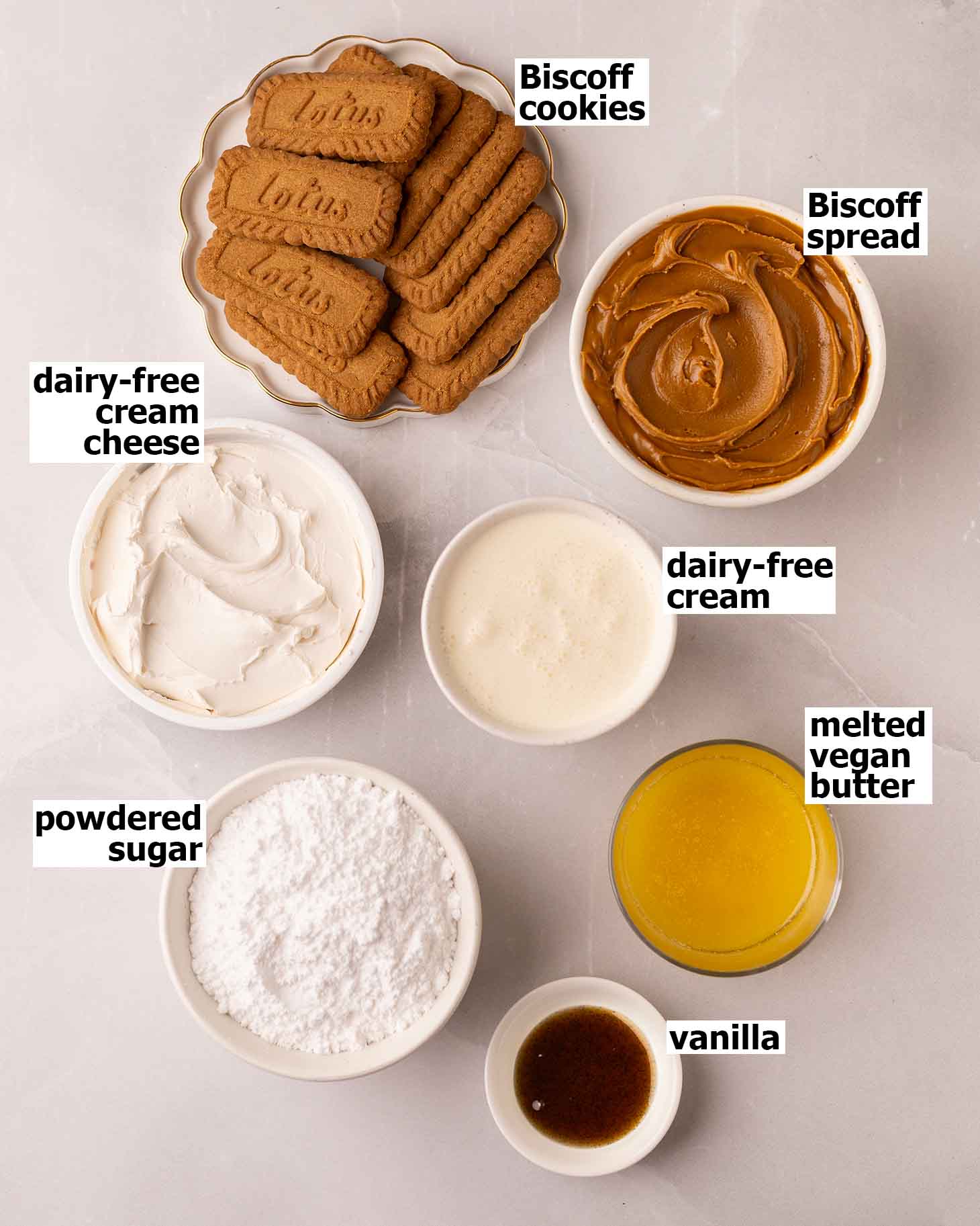 Flat-lay of ingredients for vegan biscoff cheesecake.