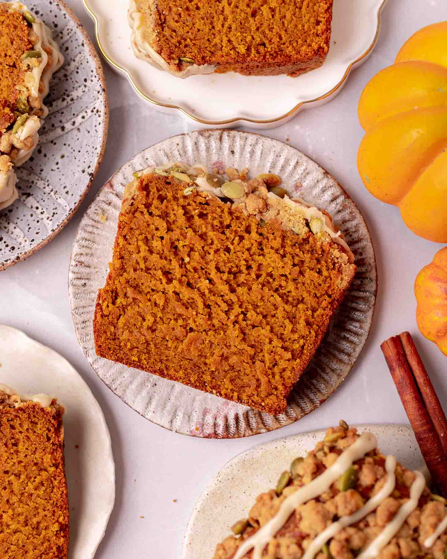 Close up of one slice of pumpkin bread on plate.