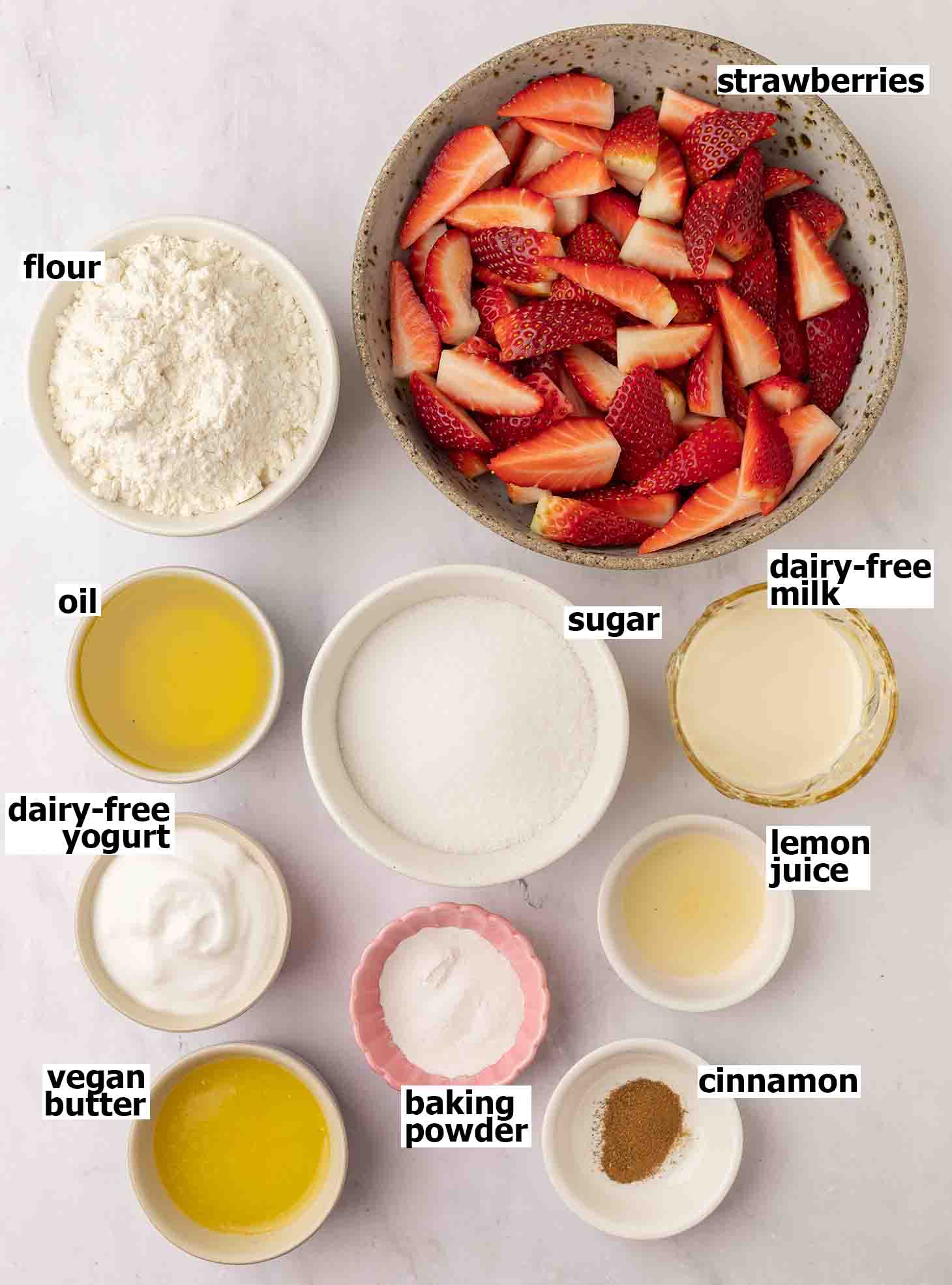Flat-lay of ingredients for strawberry crumble cake.