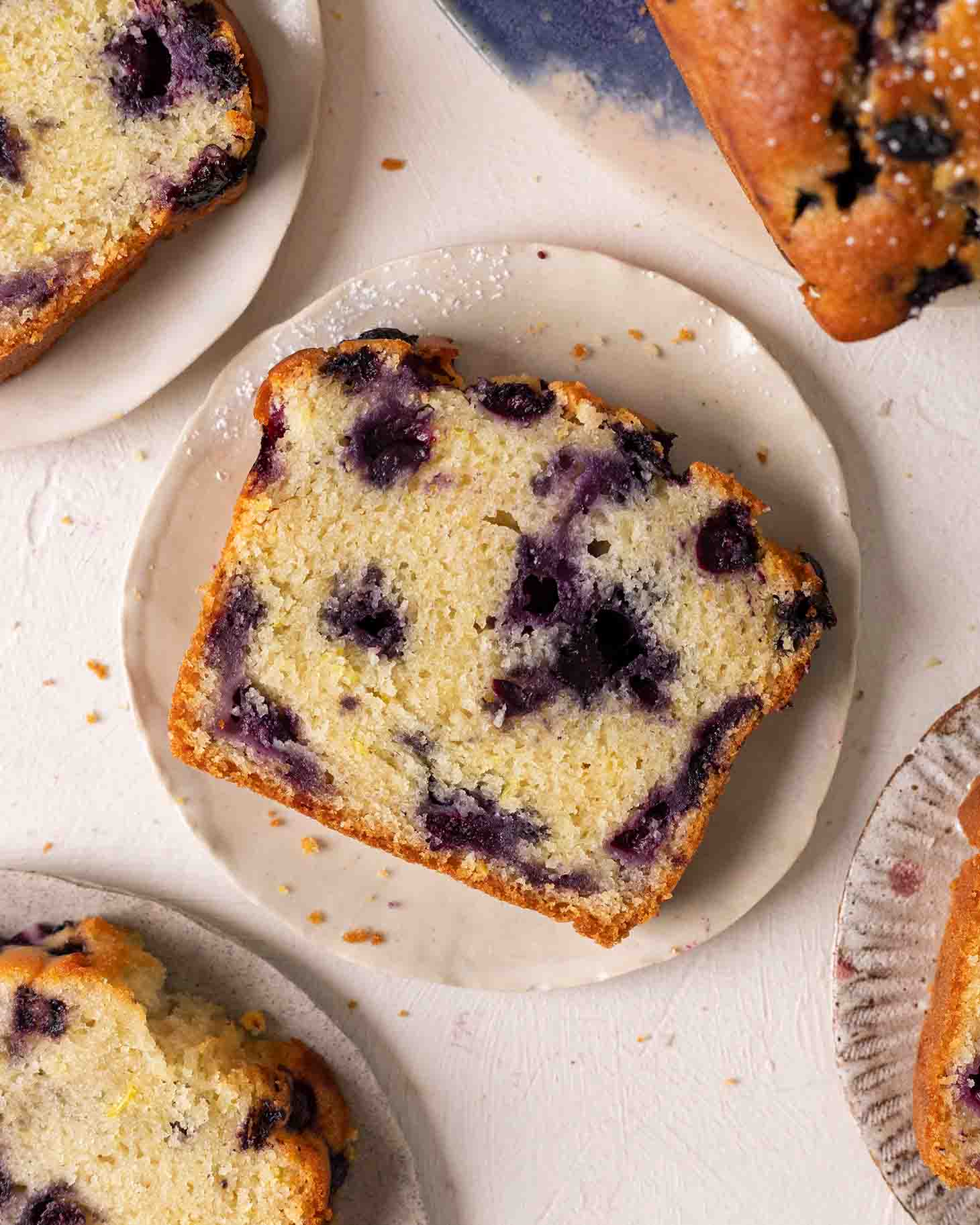 Close up of one slice of blueberry bread.