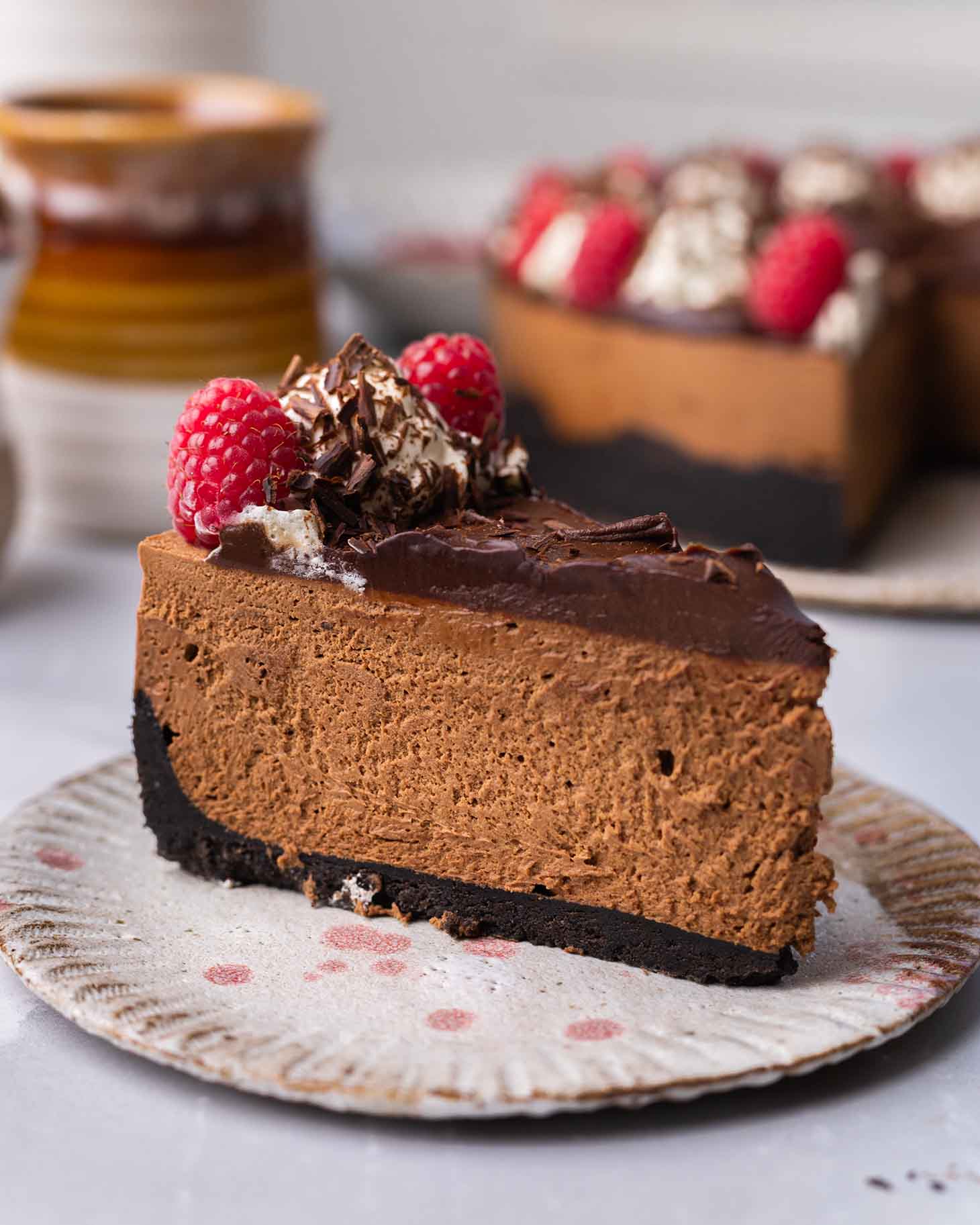 Close up of one slice of chocolate cheesecake.
