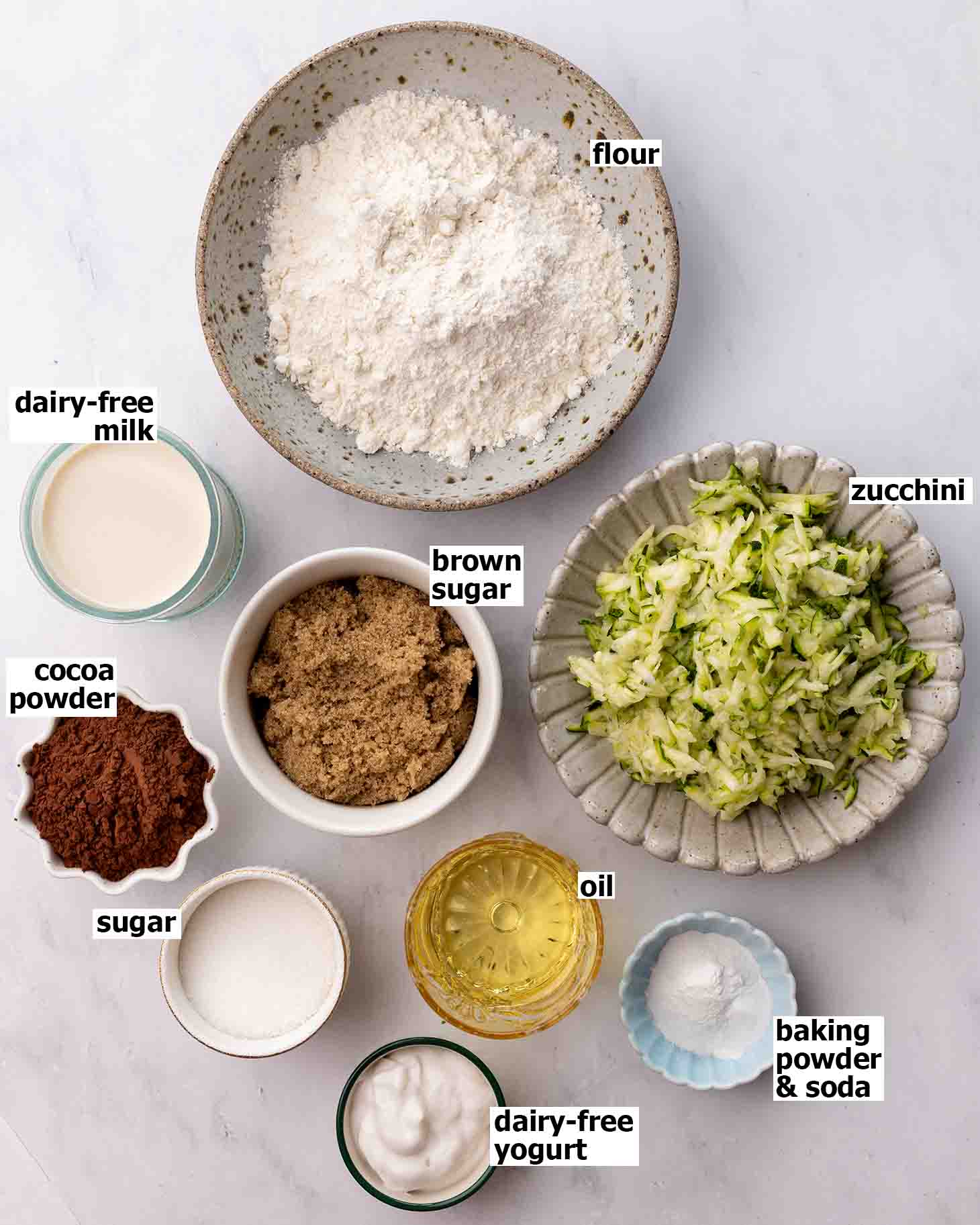 Flat-lay of ingredients for chocolate zucchini cake.