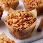 Close up of jumbo apple muffins in brown tulip liners.