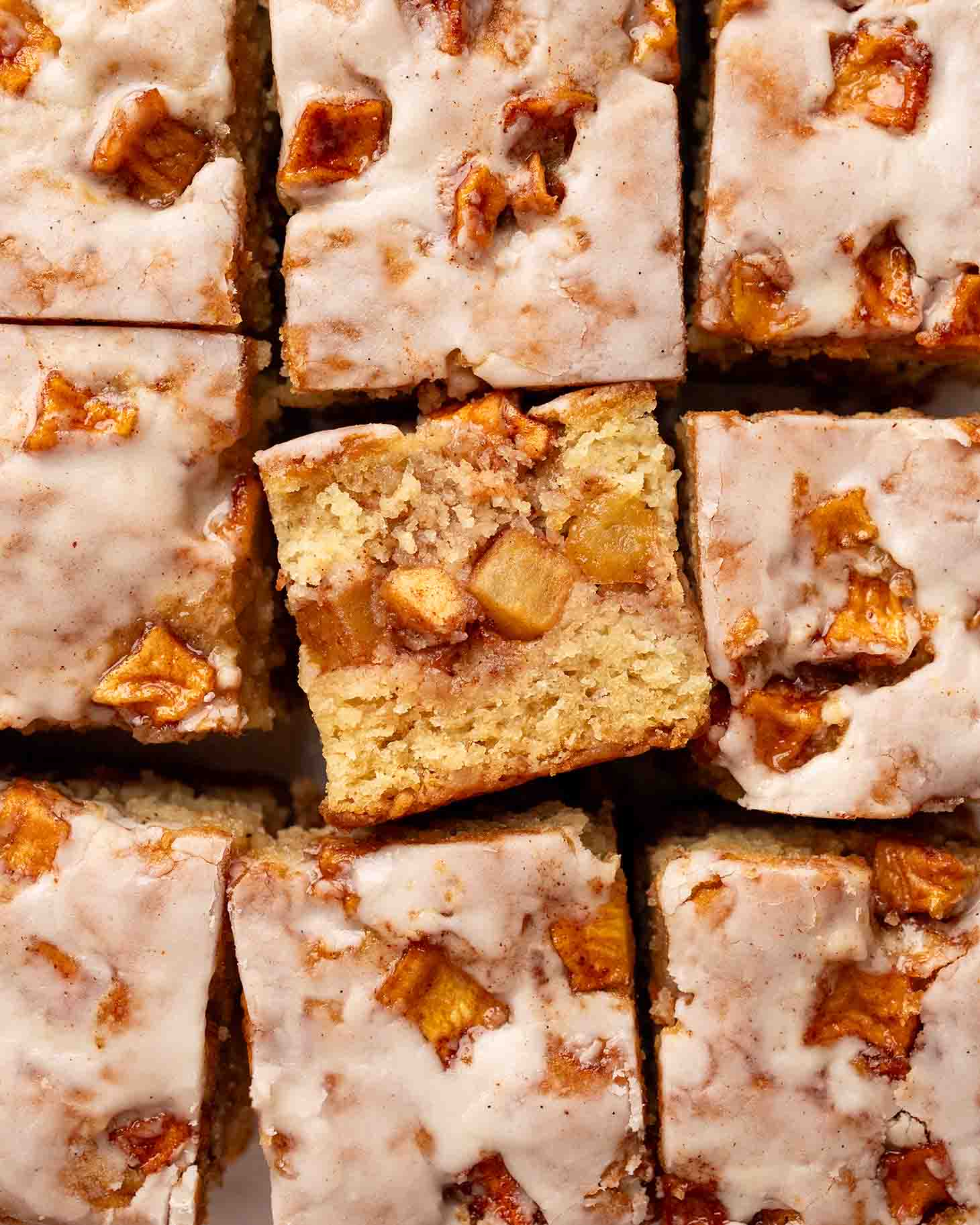 Close up on one slice of vegan apple fritter cake.